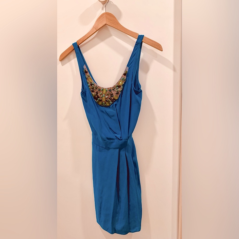 Blue silk cocktail dress with sparkly gemstone detail